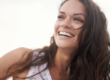 woman smiling after microneedling treatment at kent laser