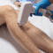 Woman having laser hair removal treatment on her leg at Kent Laser