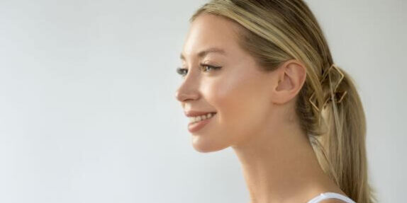 woman smiling, with smooth skin, after polynucleotides treatment in Kent
