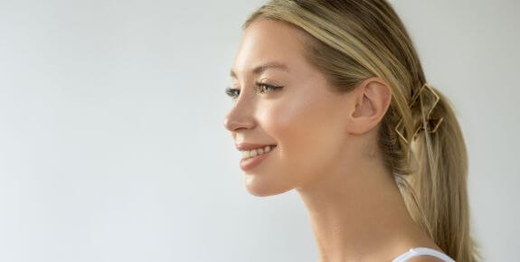 woman smiling, with smooth skin, after polynucleotides treatment in Kent